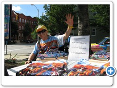 Dr. Bob Hieronimus with the posters and t-shirts of the "We the People" mural.