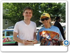 Mural artist Billy Mitchell and Dr. Bob reunite over pizza and mural memories at the party. Joe Squared donated the pizza for the event.