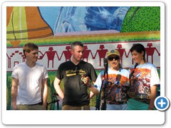 Mural artists taking a bow: Billy Mitchell, Greg Gannon, Dr. Bob and Kasey Jones.