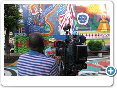 Dr. Bob explains some of the symbolism behind the mural.